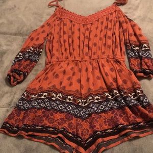 Orange patterned romper with some white & blue